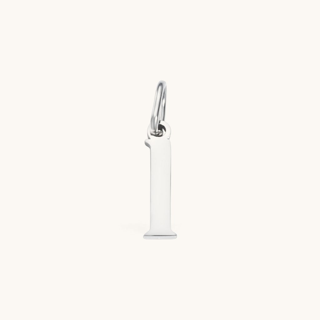Nadare Co. silver-tone stainless steel lowercase letter l charm for everyday layering and jewelry styling.
