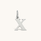 Nadare Co. silver-toned lowercase letter X charm pendant for everyday jewelry layering