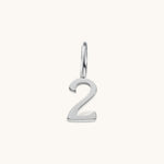 Nadare Co. silver-toned number 2 charm made from stainless steel, perfect for minimalist jewelry layering.