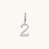 Nadare Co. silver-toned number 2 charm made from stainless steel, perfect for minimalist jewelry layering.