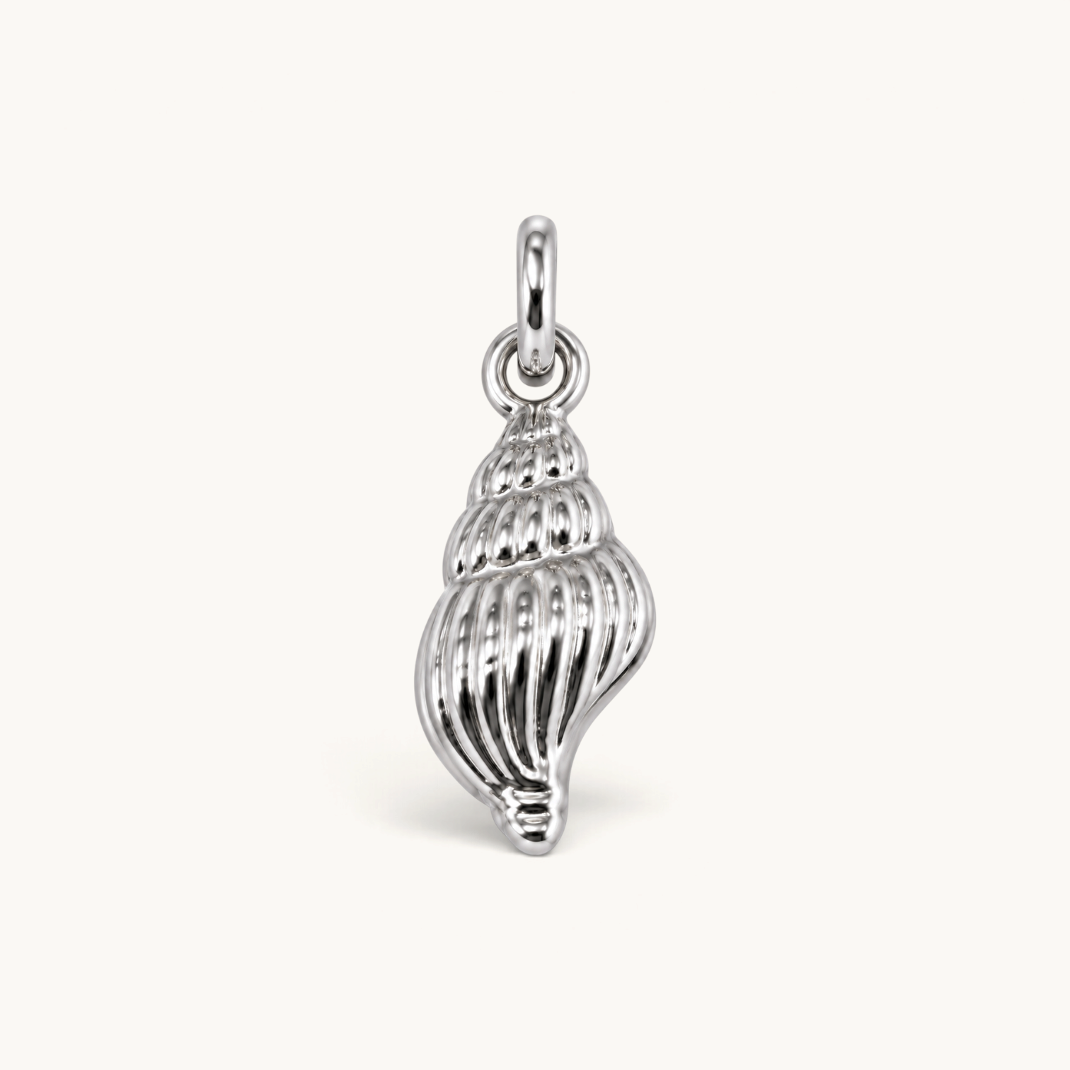 Nadare Co. silver-toned spiral seashell charm with detailed ridges and a polished finish for jewelry layering.