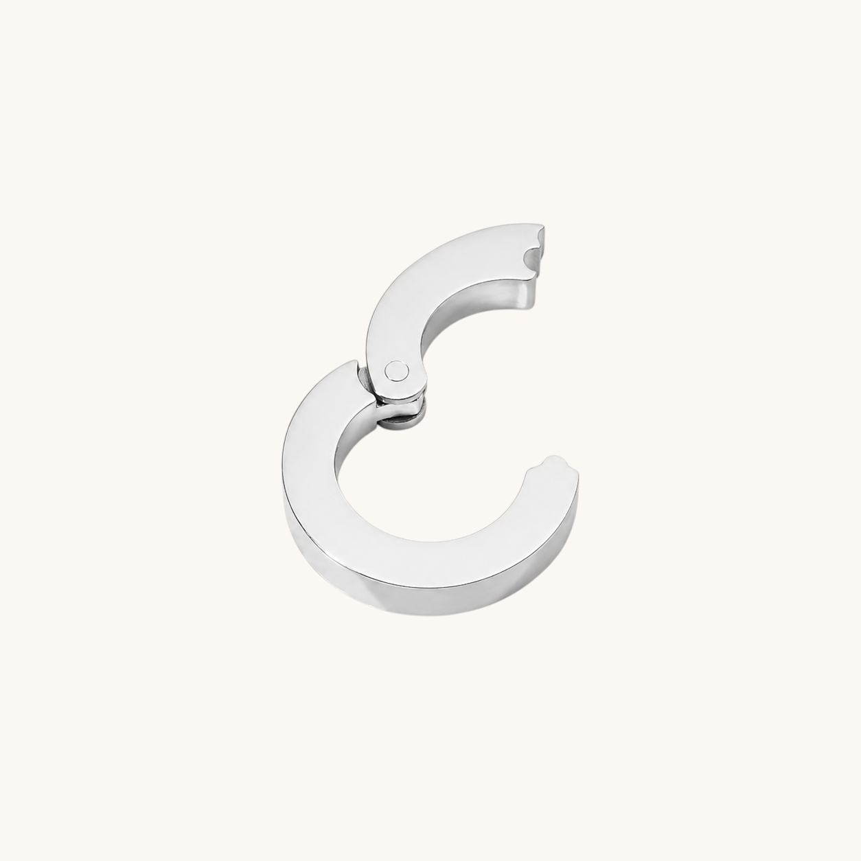 Nadare Co. silver circular switch clasp for charm necklaces, designed to hold up to three charms.