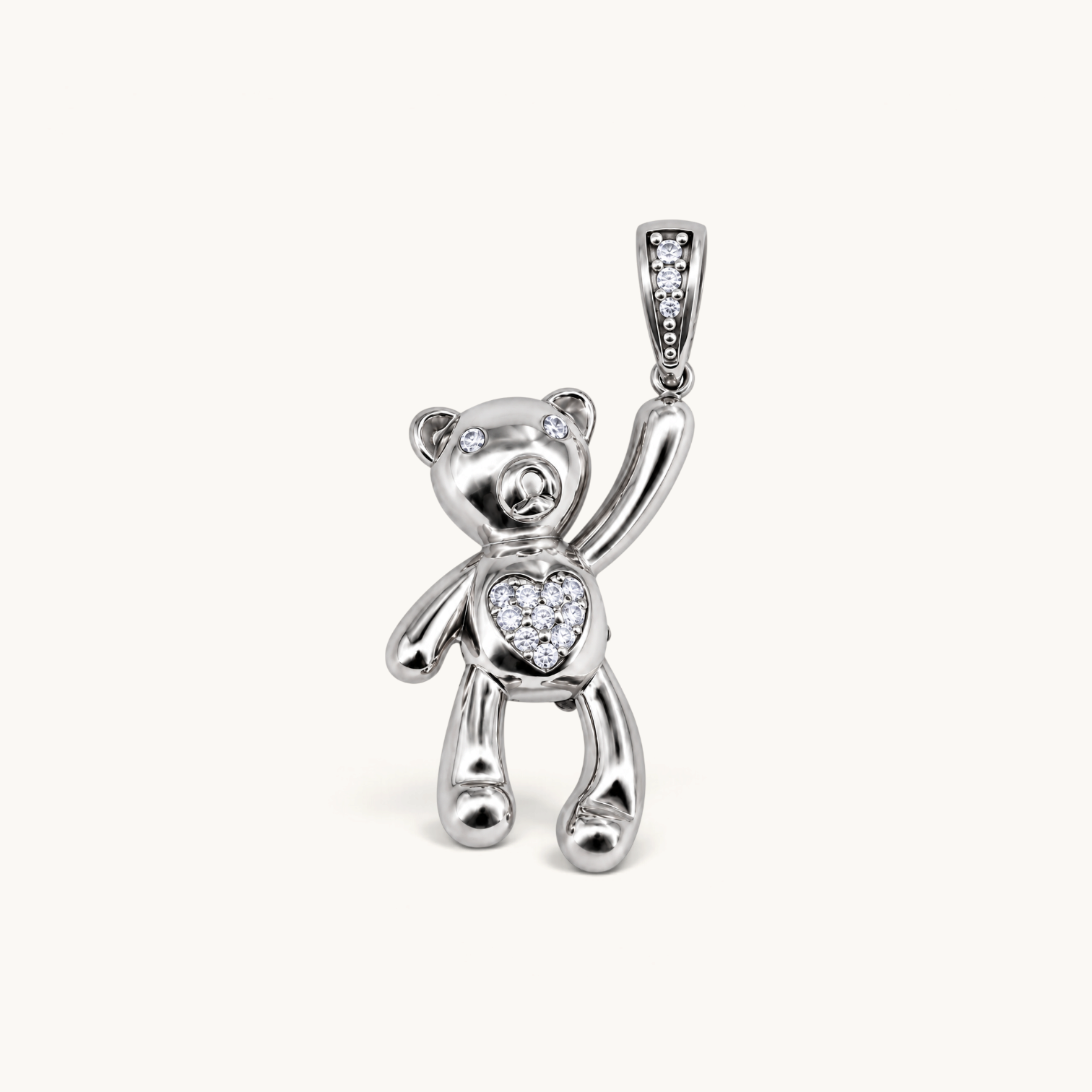 Nadare Co. silver teddy bear charm with cubic zirconia heart, eyes, and pavé bail on a neutral background.