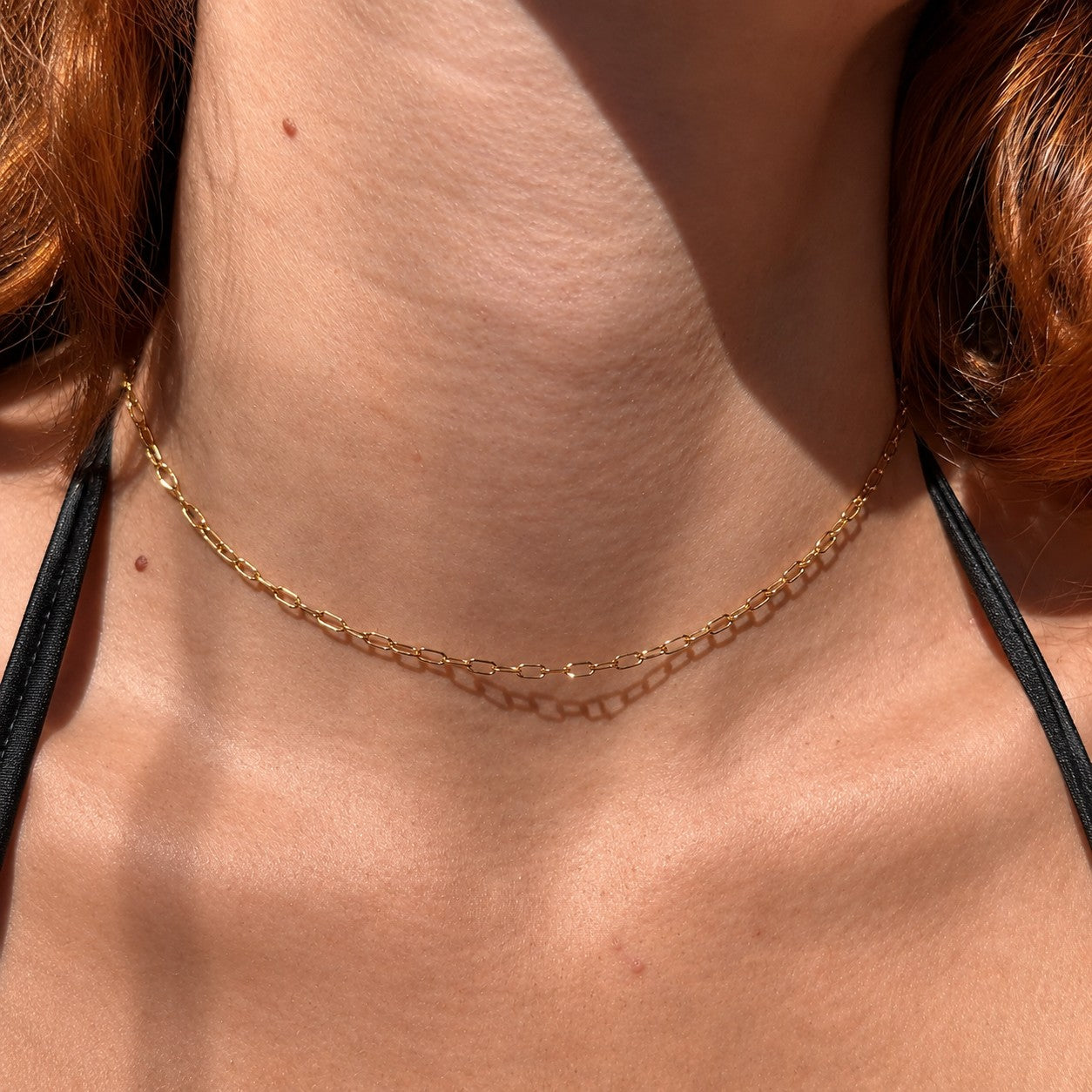 Nadare Co. Sloane necklace featuring delicate gold elongated chain links worn around the neck
