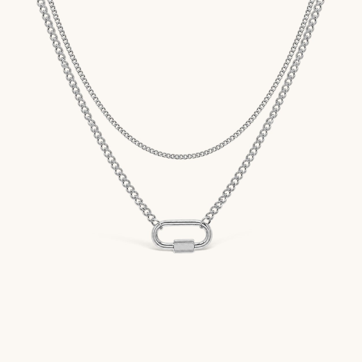 Nadare Co. Sylvie silver layered necklace with a delicate chain, curb chain, and functional carabiner clasp.