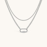Nadare Co. Sylvie silver layered necklace with a delicate chain, curb chain, and functional carabiner clasp.
