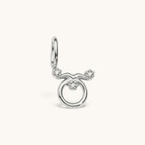 Nadare Co. silver-tone Taurus zodiac charm featuring cubic zirconia accents on a stainless steel base.